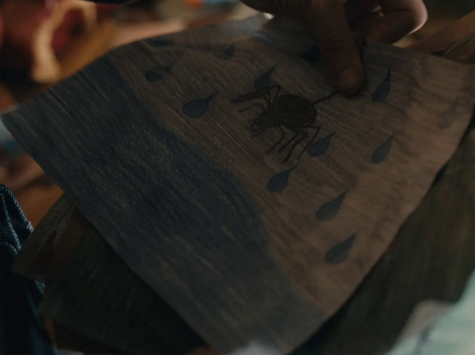 Victor's drawing with a lake, \'tears\' and a spider